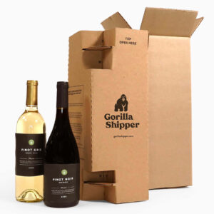 Two wine bottles next to cardboard packaging