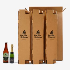 Bottles next to cardboard packaging File name: 12-pack-beer-shipper