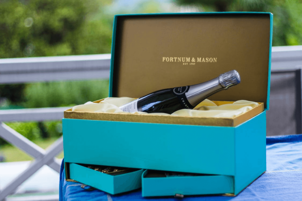 Bottle of champagne displayed in a turquoise gift box