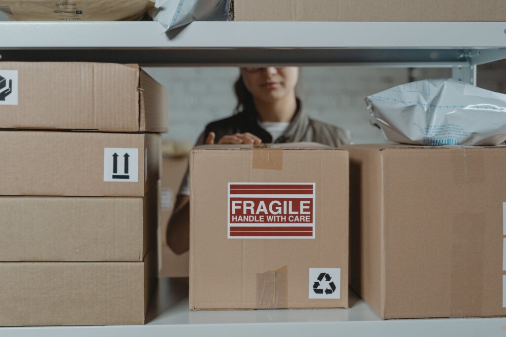 Woman inspecting boxes on a shelf