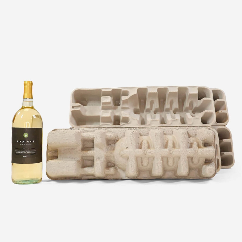 A wine bottle next to molded pulp inserts
