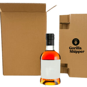 A bottle of alcohol in front of cardboard boxes