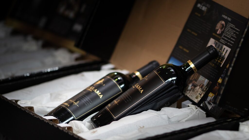 Black wine bottles displayed in a gift box