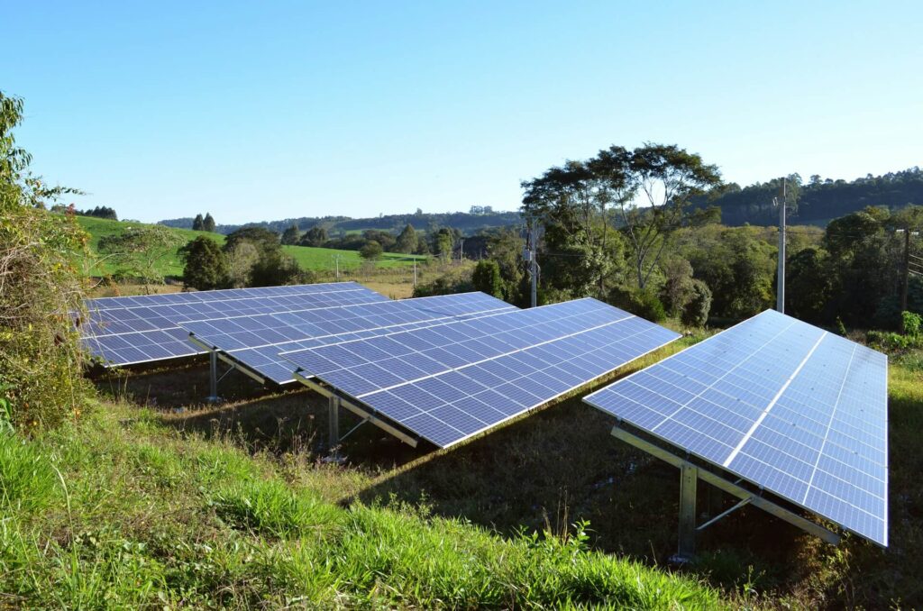 Solar panel row adjacent to a farm