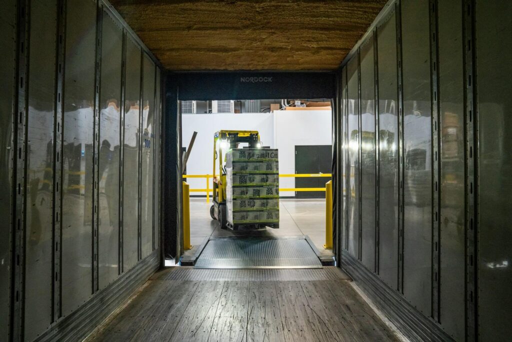 Forklift loading products into a tractor-trailer