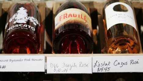 Three bottles of wine on display in a winery