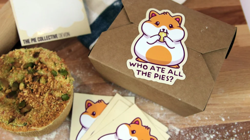 A box of pies sealed with a cute hamster sticker