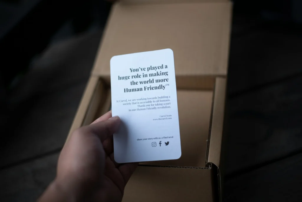 Man holding a personalized message after unboxing