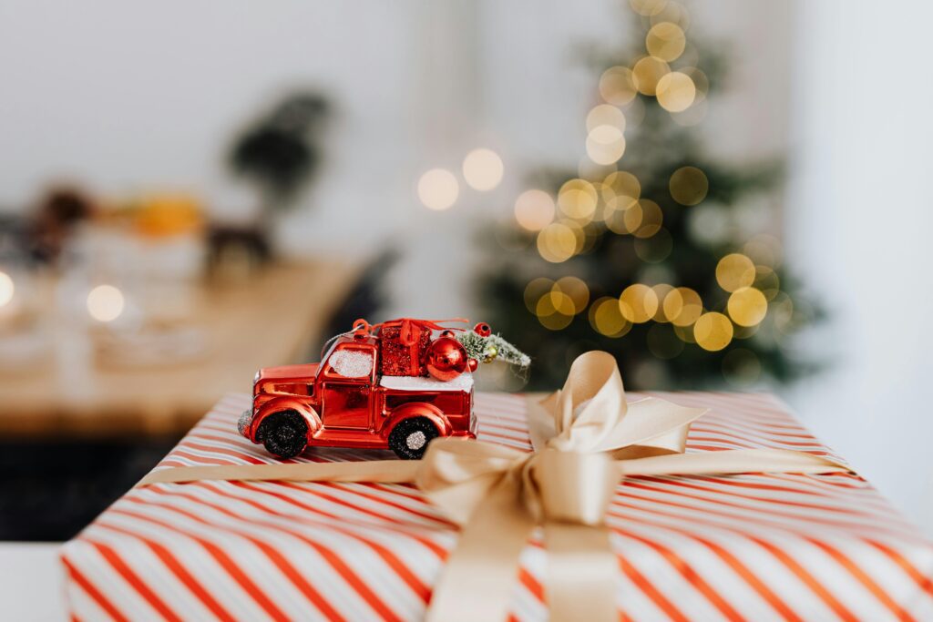 Red truck Christmas ornament on wrapped package