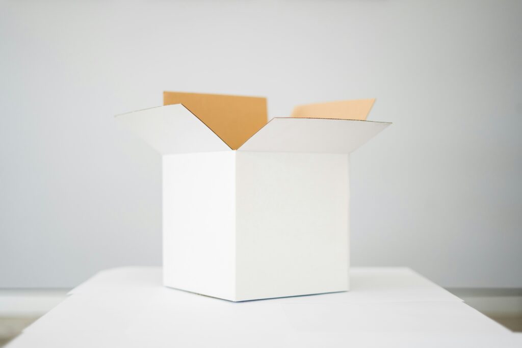 Plain white discreet shipping box that is open at the top