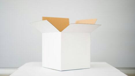 Plain white discreet shipping box that is open at the top